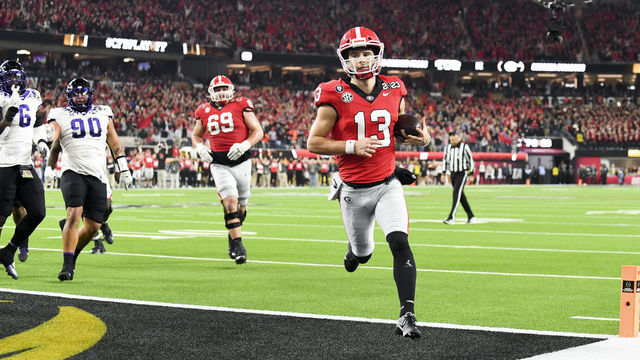 LOS ANGELES, CA - JANUARY 09: Georgia Bulldogs quarterback Stetson Bennett (13) runs in for his second touchdown during the first half the CFP National Championship game against the TCU Horned Frogs at SoFi Stadium on Monday, Jan. 9, 2023 in Los Angeles, CA.(Wally Skalij / Los Angeles Times via Getty Images)