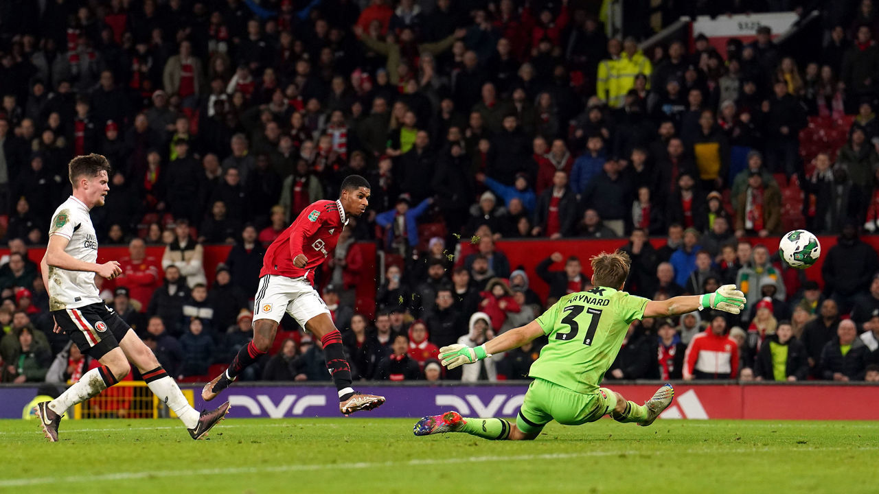 Manchester United's Marcus Rashford scores their side's third goal of the game during the Carabao Cup Quarter-Final match at Old Trafford, Manchester. Picture date: Tuesday January 10, 2023.