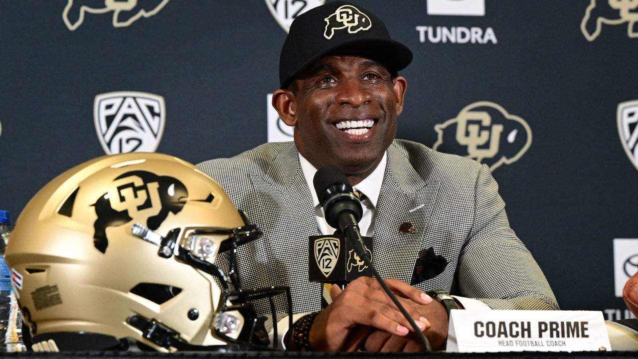 BOULDER, CO - DECEMBER 4: Deion Sanders, CUs new head football coach, takes questions in the Arrow Touchdown Club during a press conference on December 4, 2022 in Boulder, Colorado. CU held an introductory press conference to announce the hiring of Deion Coach Prime Sanders as the schools new head football coach. Chancellor Phil DiStefano and athletic director Rick George accompanied Sanders into a packed room in the Arrow Touchdown Club inside the Dal Ward Athletic Center. Sanders becomes the 28th head coach in Buffalo football history. Sanders, who known as Prime Time during his Hall of Fame playing career has since transitioned into Coach Prime as a head football coach. Sanders, 55, joins the CU program from Jackson State University where in three seasons the Tigers compiled a 27-5 record and won back-to-back Southwestern Athletic Conference championships.