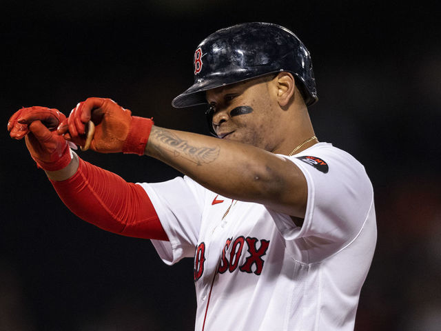 BOSTON, MA - SEPTEMBER 27: Rafael Devers #11 of the Boston Red Sox reacts after hitting a single during the first inning of a game against the Baltimore Orioles on September 27, 2022 at Fenway Park in Boston, Massachusetts.
