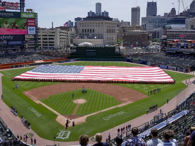 DETROIT, MICHIGAN - JULY 04: The American flag is presented during the national anthem before the game between the Detroit Tigers and Cleveland Guardians at Comerica Park on July 04, 2022 in Detroit, Michigan.