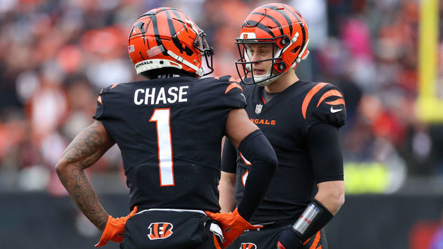 CINCINNATI, OH - JANUARY 08: Cincinnati Bengals wide receiver Ja'Marr Chase (1) talks to quarterback Joe Burrow (9) during a stop in play. In the game against the Baltimore Ravens and the Cincinnati Bengals on January 8, 2023, at Paycor Stadium in Cincinnati, OH.