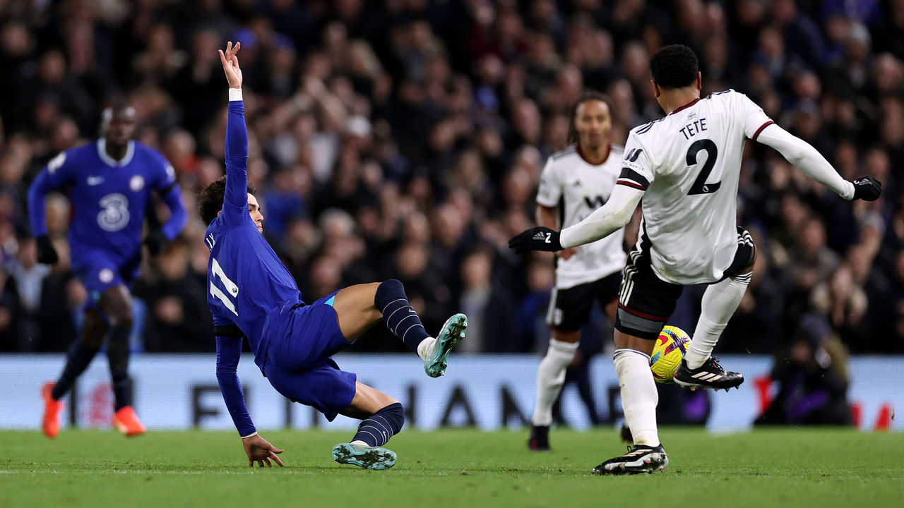 LONDON, ENGLAND - JANUARY 12: Joao Felix of Chelsea tackles Kenny Tete of Fulham which results in a red card during the Premier League match between Fulham FC and Chelsea FC at Craven Cottage on January 12, 2023 in London, England.