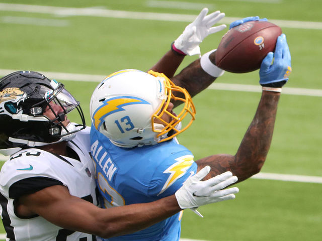 INGLEWOOD, CALIFORNIA - OCTOBER 25: Keenan Allen #13 of the Los Angeles Chargers makes a catch against CJ Henderson #23 of the Jacksonville Jaguars during the first quarter at SoFi Stadium on October 25, 2020 in Inglewood, California.