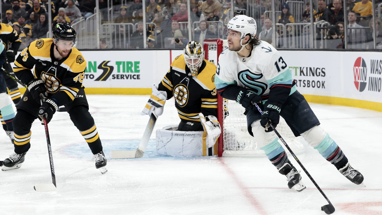 BOSTON, MA - JANUARY 12: Seattle Kraken left wing Brandon Tanev (13) looks back to the point during a game between the Boston Bruins and the Seattle Kraken on January 12, 2023, at TD Garden in Boston, Massachusetts.