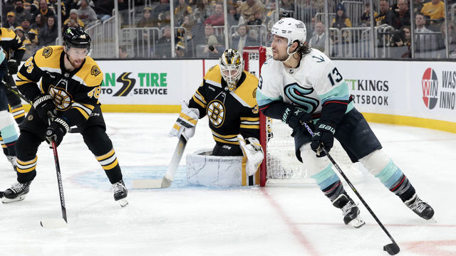 BOSTON, MA - JANUARY 12: Seattle Kraken left wing Brandon Tanev (13) looks back to the point during a game between the Boston Bruins and the Seattle Kraken on January 12, 2023, at TD Garden in Boston, Massachusetts.