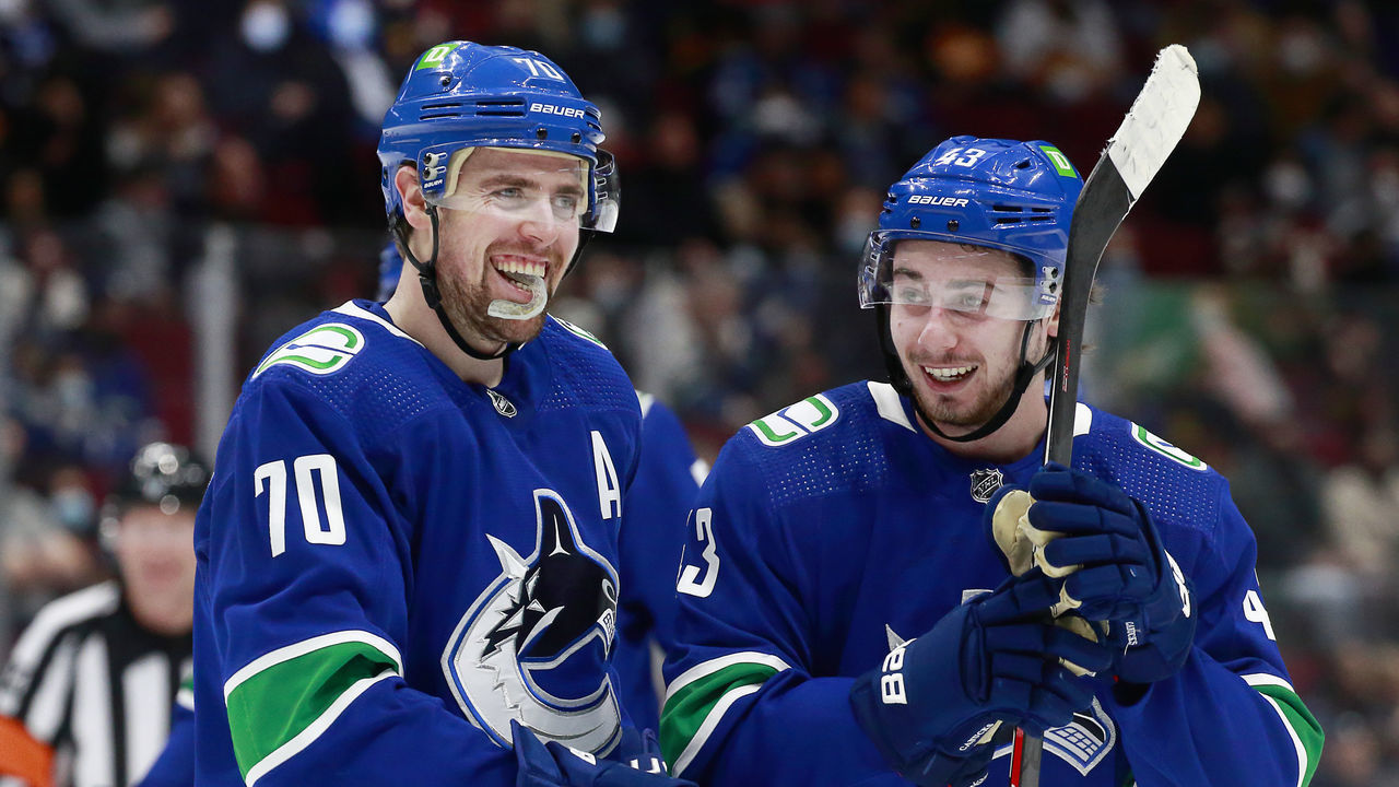 VANCOUVER, BC - JANUARY 21: Tanner Pearson #70 and Quinn Hughes #43 of the Vancouver Canucks skate up the ice during their NHL game against the Florida Panthers at Rogers Arena January 21, 2022 in Vancouver, British Columbia, Canada.