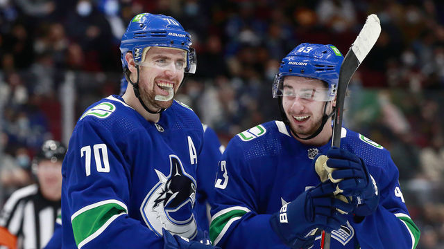 VANCOUVER, BC - JANUARY 21: Tanner Pearson #70 and Quinn Hughes #43 of the Vancouver Canucks skate up the ice during their NHL game against the Florida Panthers at Rogers Arena January 21, 2022 in Vancouver, British Columbia, Canada.