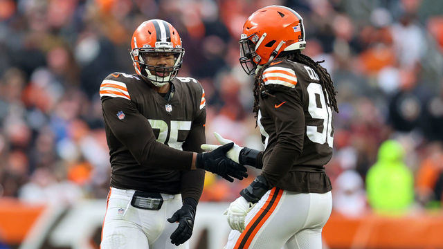 CLEVELAND, OH - JANUARY 09: Cleveland Browns defensive end Myles Garrett (95) and Cleveland Browns defensive end Jadeveon Clowney (90) celebrate after Garrett got a quarterback sack during the third quarter of the National Football League game between the Cincinnati Bengals and Cleveland Browns on January 9, 2022, at FirstEnergy Stadium in Cleveland, OH.
