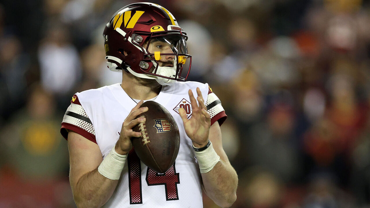 LANDOVER, MARYLAND - JANUARY 08: Quarterback Sam Howell #14 of the Washington Commanders drops back to pass against the Dallas Cowboys at FedExField on January 08, 2023 in Landover, Maryland.