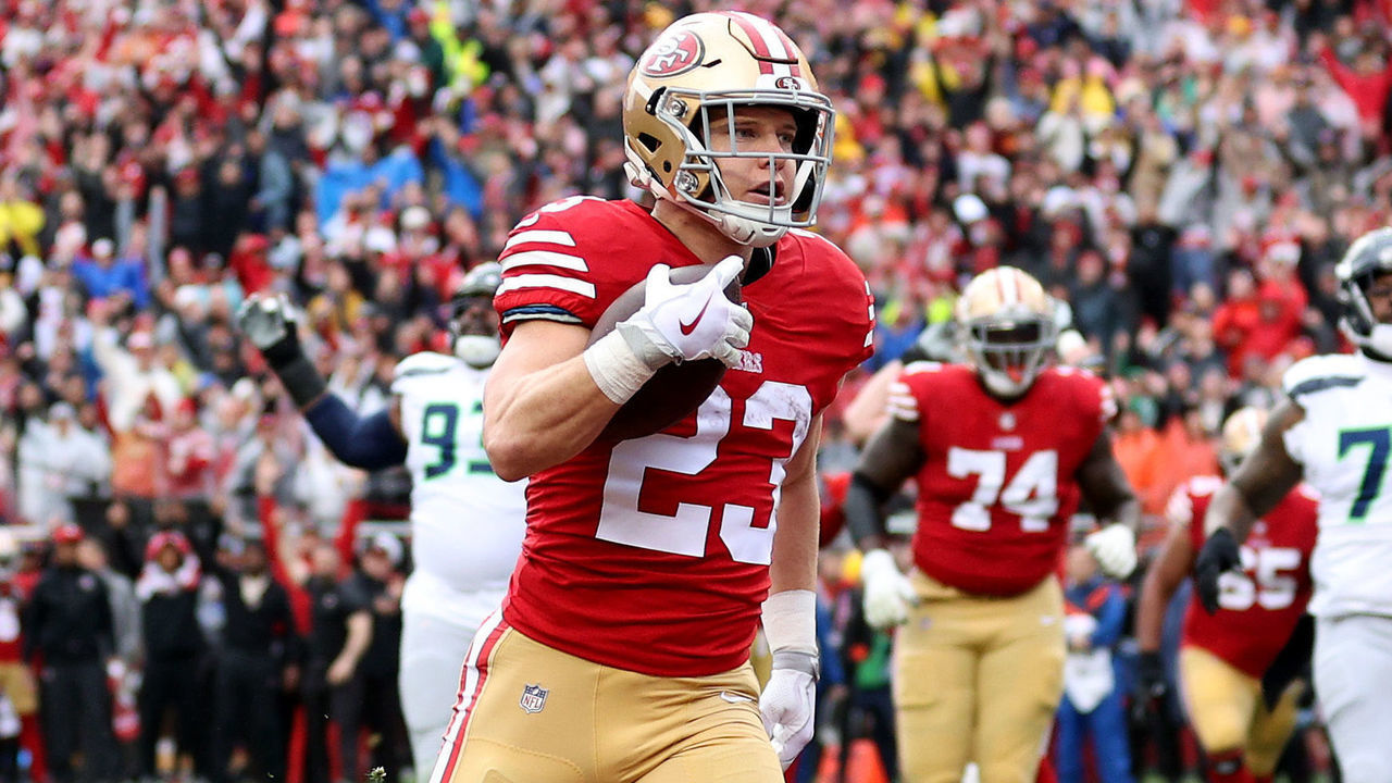 SANTA CLARA, CALIFORNIA - JANUARY 14: Christian McCaffrey #23 of the San Francisco 49ers celebrates after scoring a 3 yard touchdown against the Seattle Seahawks during the first quarter in the NFC Wild Card playoff game at Levi's Stadium on January 14, 2023 in Santa Clara, California.