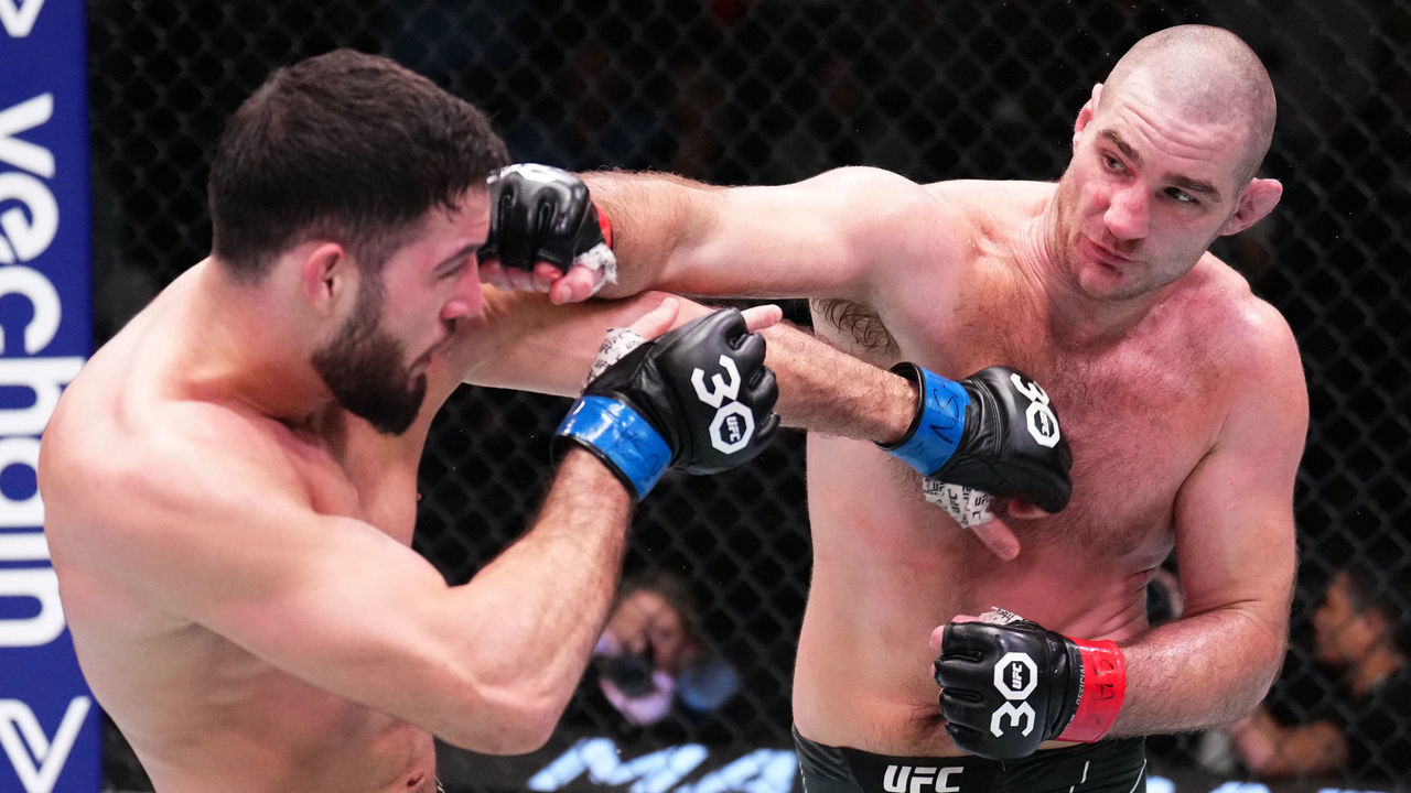 LAS VEGAS, NEVADA - JANUARY 14: (R-L) Sean Strickland punches Nassourdine Imavov of Russia in a light heavyweight fight during the UFC Fight Night event at UFC APEX on January 14, 2023 in Las Vegas, Nevada.