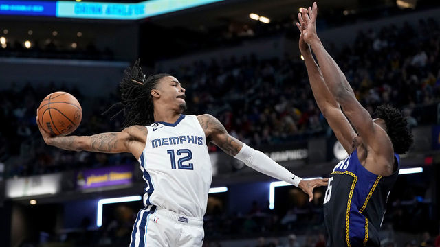 INDIANAPOLIS, INDIANA - JANUARY 14: Ja Morant #12 of the Memphis Grizzlies dunks the ball over Jalen Smith #25 of the Indiana Pacers in the third quarter at Gainbridge Fieldhouse on January 14, 2023 in Indianapolis, Indiana.