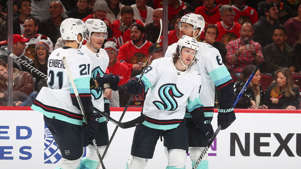 CHICAGO, ILLINOIS - JANUARY 14: Jared McCann #19 of the Seattle Kraken celebrates with teammates after scoring against the Chicago Blackhawks in the first period at United Center on January 14, 2023 in Chicago, Illinois.