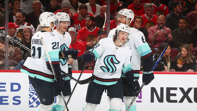 CHICAGO, ILLINOIS - JANUARY 14: Jared McCann #19 of the Seattle Kraken celebrates with teammates after scoring against the Chicago Blackhawks in the first period at United Center on January 14, 2023 in Chicago, Illinois.