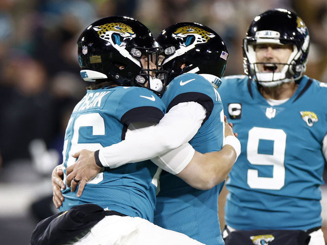 JACKSONVILLE, FLORIDA - JANUARY 14: Riley Patterson #10 of the Jacksonville Jaguars celebrates with teammates after kicking a field goal to defeat the Los Angeles Chargers 31-30 in the AFC Wild Card playoff game at TIAA Bank Field on January 14, 2023 in Jacksonville, Florida.
