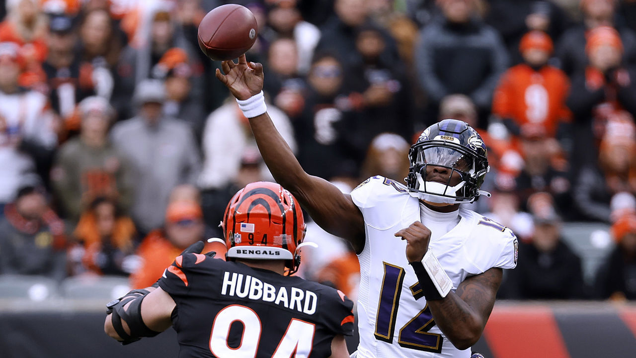 CINCINNATI, OHIO - JANUARY 08: Anthony Brown #12 of the Baltimore Ravens throws the ball over Sam Hubbard #94 of the Cincinnati Bengals during the first half at Paycor Stadium on January 08, 2023 in Cincinnati, Ohio.