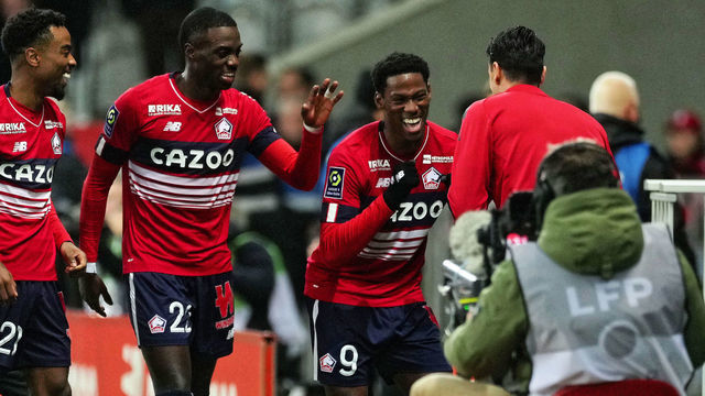 LILLE, FRANCE - JANUARY 15: Jonathan David of Lille OSC celebrates after scoring his team's 2nd goal during the Ligue 1 Uber Eats match between Lille OSC (LOSC) and ESTAC Troyes at Stade Pierre Mauroy on January 15, 2023 in Lille, France.