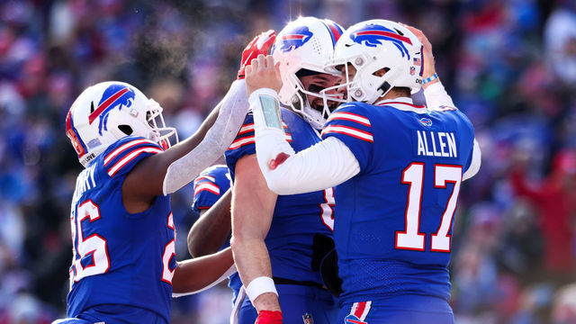 ORCHARD PARK, NEW YORK - JANUARY 15: Devin Singletary #26, Dawson Knox #88 and Josh Allen #17 of the Buffalo Bills celebrate on the field during the second quarter of the game against the Miami Dolphins in the AFC Wild Card playoff game at Highmark Stadium on January 15, 2023 in Orchard Park, New York.