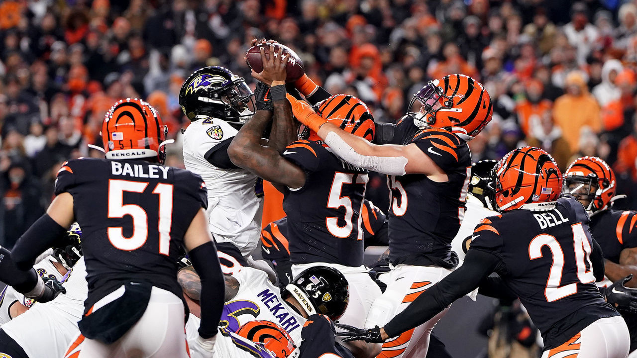 CINCINNATI, OHIO - JANUARY 15: Tyler Huntley #2 of the Baltimore Ravens fumbles the ball that is recovered by Sam Hubbard #94 of the Cincinnati Bengals to score a 98 yard touchdown during the fourth quarter in the AFC Wild Card playoff game at Paycor Stadium on January 15, 2023 in Cincinnati, Ohio.