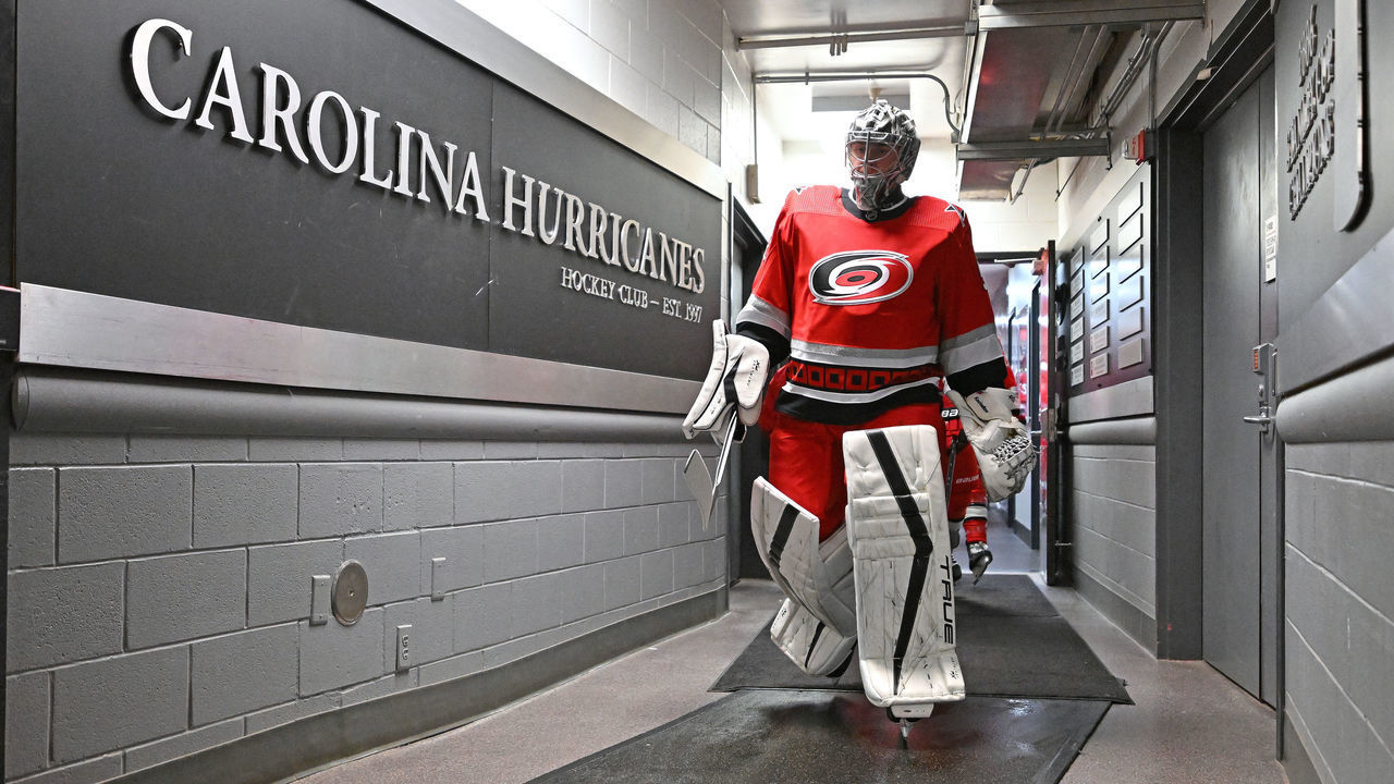 RALEIGH, NORTH CAROLINA - DECEMBER 15: Pyotr Kochetkov #52 of the Carolina Hurricanes leads the team onto the ice for their game against the Seattle Kraken at PNC Arena on December 15, 2022 in Raleigh, North Carolina. The Hurricanes won 3-2.