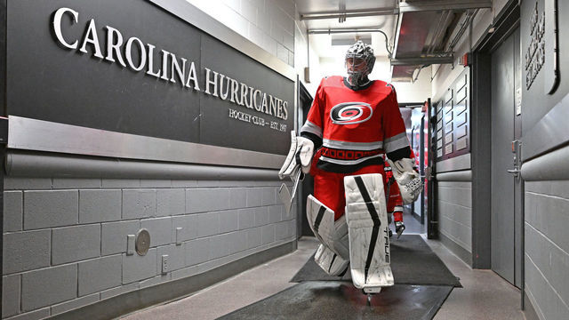 RALEIGH, NORTH CAROLINA - DECEMBER 15: Pyotr Kochetkov #52 of the Carolina Hurricanes leads the team onto the ice for their game against the Seattle Kraken at PNC Arena on December 15, 2022 in Raleigh, North Carolina. The Hurricanes won 3-2.