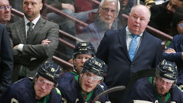 VANCOUVER, CANADA - DECEMBER 19: Bruce Boudreau, Brock Boeser #6, J.T. Miller #9, and Bo Horvat #53 of the Vancouver Canucks look on from the bench during their NHL game against the St. Louis Blues at Rogers Arena December 19, 2022 in Vancouver, British Columbia, Canada. St. Louis Blues won 5-1.