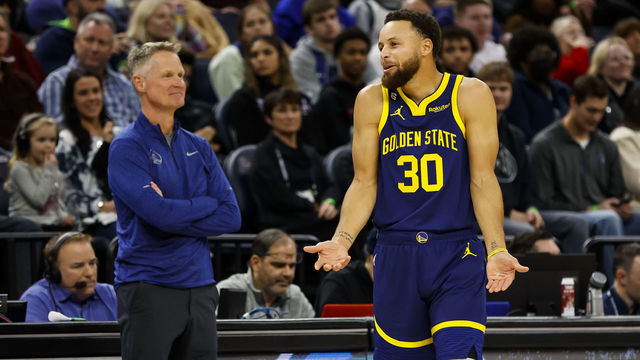 MINNEAPOLIS, MN - NOVEMBER 27: Stephen Curry #30 of the Golden State Warriors reacts to a call on the floor while head coach Steve Kerr looks on in the second quarter of the game against the Minnesota Timberwolves at Target Center on November 27, 2022 in Minneapolis, Minnesota. The Warriors defeated the Timberwolves 137-114.