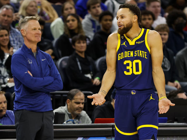 MINNEAPOLIS, MN - NOVEMBER 27: Stephen Curry #30 of the Golden State Warriors reacts to a call on the floor while head coach Steve Kerr looks on in the second quarter of the game against the Minnesota Timberwolves at Target Center on November 27, 2022 in Minneapolis, Minnesota. The Warriors defeated the Timberwolves 137-114.