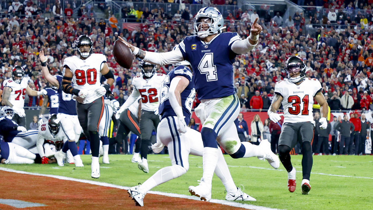 TAMPA, FLORIDA - JANUARY 16: Dak Prescott #4 of the Dallas Cowboys rushes for a touchdown against the Tampa Bay Buccaneers during the second quarter in the NFC Wild Card playoff game at Raymond James Stadium on January 16, 2023 in Tampa, Florida.