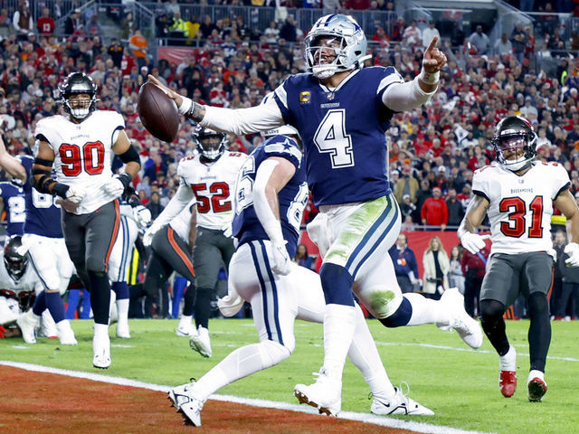 TAMPA, FLORIDA - JANUARY 16: Dak Prescott #4 of the Dallas Cowboys rushes for a touchdown against the Tampa Bay Buccaneers during the second quarter in the NFC Wild Card playoff game at Raymond James Stadium on January 16, 2023 in Tampa, Florida.