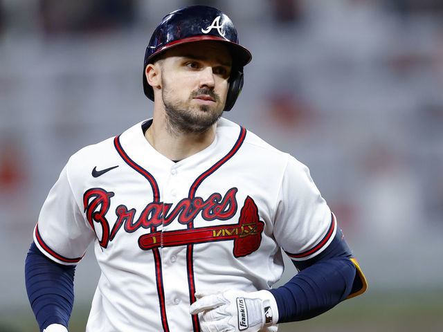 ATLANTA, GA - JULY 12: Adam Duvall #14 of the Atlanta Braves approaches third base after hitting a two run home run during the seventh inning against the New York Mets at Truist Park on July 12, 2022 in Atlanta, Georgia.