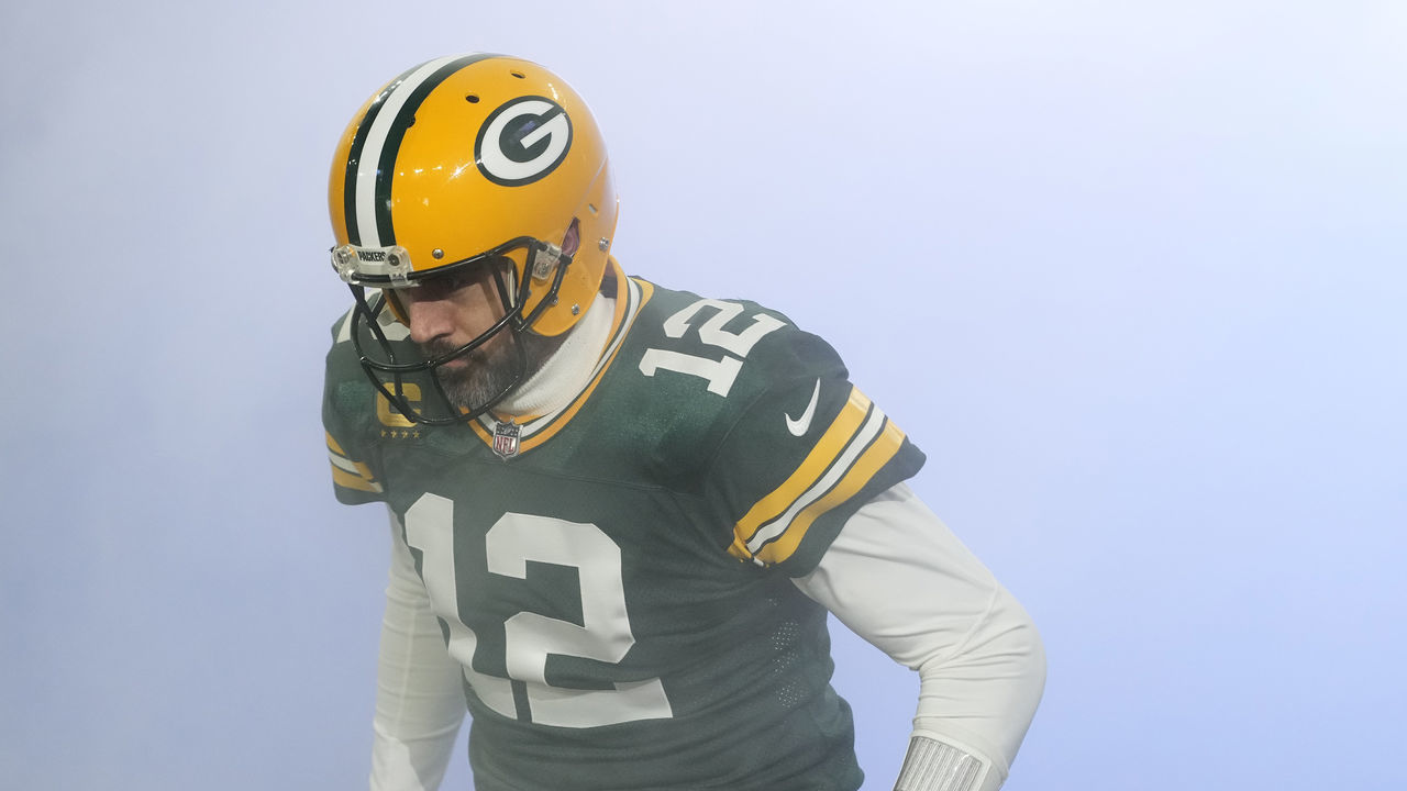GREEN BAY, WISCONSIN - JANUARY 08: Aaron Rodgers #12 of the Green Bay Packers runs onto the field before a game against the Detroit Lions at Lambeau Field on January 08, 2023 in Green Bay, Wisconsin.