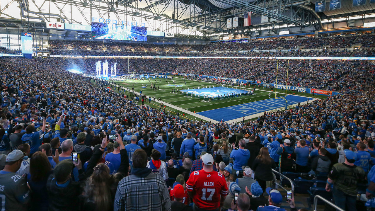 DETROIT, MI - NOVEMBER 24: Fans cheer as the Detroit Lions team runs onto the field before the start of a regular season NFL football game between the Buffalo Bills and the Detroit Lions on Thanksgiving Day on November 24, 2022 at Ford Field in Detroit, Michigan.