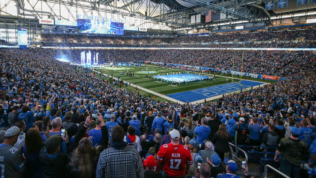 DETROIT, MI - NOVEMBER 24: Fans cheer as the Detroit Lions team runs onto the field before the start of a regular season NFL football game between the Buffalo Bills and the Detroit Lions on Thanksgiving Day on November 24, 2022 at Ford Field in Detroit, Michigan.