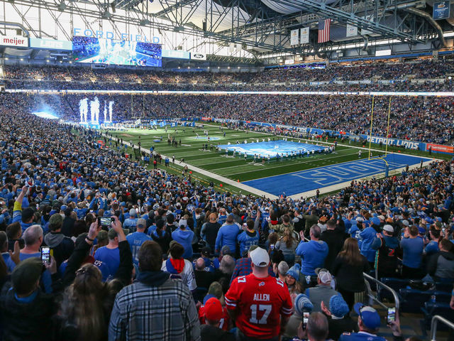 DETROIT, MI - NOVEMBER 24: Fans cheer as the Detroit Lions team runs onto the field before the start of a regular season NFL football game between the Buffalo Bills and the Detroit Lions on Thanksgiving Day on November 24, 2022 at Ford Field in Detroit, Michigan.