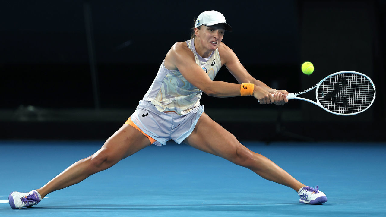 MELBOURNE, AUSTRALIA - JANUARY 18: Iga Swiatek of Poland plays a backhand in their round two singles match against Camila Osorio of Colombia during day three of the 2023 Australian Open at Melbourne Park on January 18, 2023 in Melbourne, Australia.