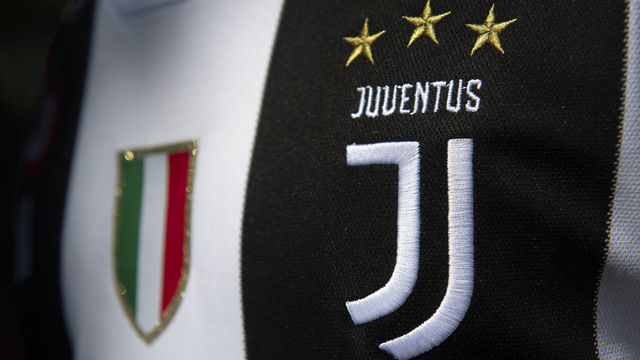 MANCHESTER, ENGLAND - MAY 06: The Juventus club crest and Italian flag on the first team home shirt on May 6, 2020 in Manchester, England