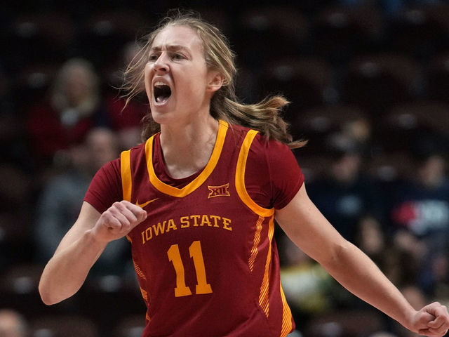 UNCASVILLE, CONNECTICUT - DECEMBER 18: Emily Ryan #11 of the Iowa State Cyclones reacts after scoring against the Villanova Wildcats during the first half of an Invesco QQQ Basketball Hall of Fame Women’s Showcase game at Mohegan Sun Arena on December 18, 2022 in Uncasville, Connecticut.
