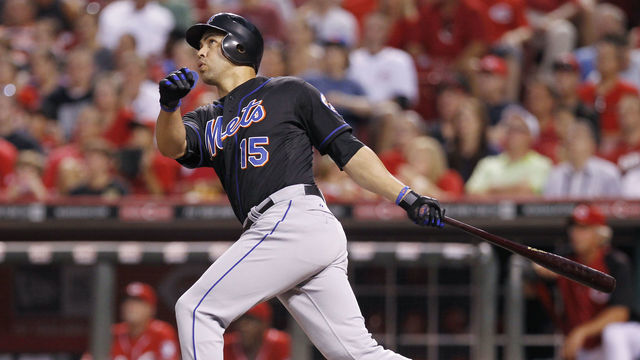 CINCINNATI, OH - JULY 25: Carlos Beltran #15 of the New York Mets drives in the game-tying run in the seventh inning with a sacrifice fly against the Cincinnati Reds at Great American Ball Park on July 25, 2011 in Cincinnati, Ohio.