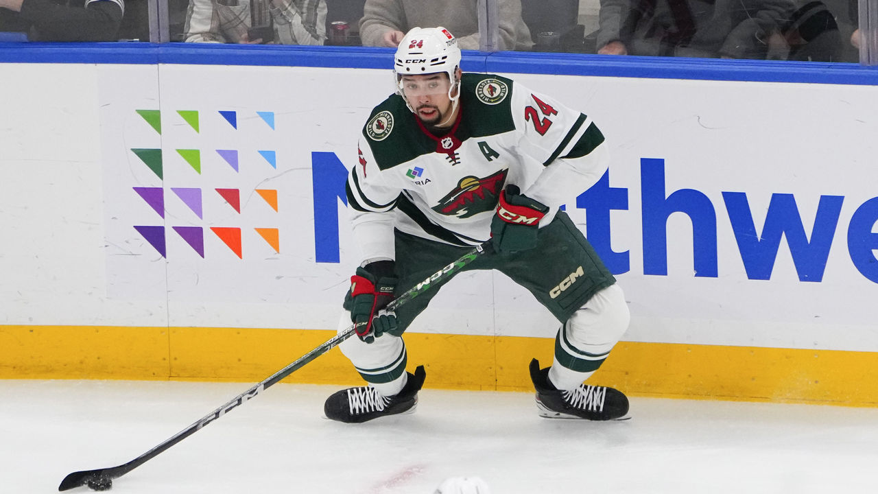 ELMONT, NY - JANUARY 12: Minnesota Wild Defenseman Matt Dumba (24) controls the puck during the second period of the National Hockey League game between the Minnesota Wild and the New York Islanders on January 12, 2023, at UBS Arena in Elmont, NY.