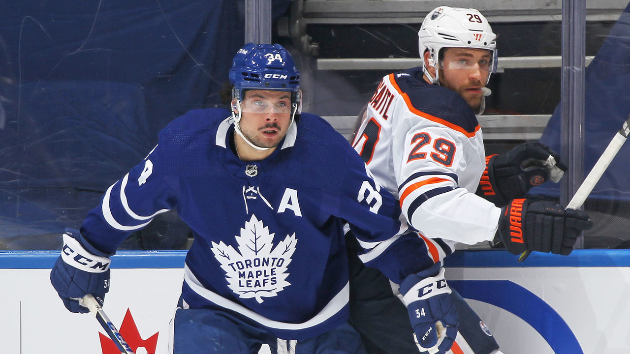 TORONTO, ON - JANUARY 5: Leon Draisaitl #29 of the Edmonton Oilers battles against Auston Matthews #34 of the Toronto Maple Leafs during an NHL game at Scotiabank Arena on January 5, 2022 in Toronto, Ontario, Canada.