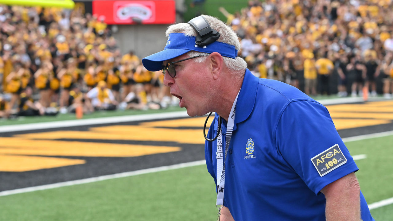 IOWA CITY, IA - SEPTEMBER 03: South Dakota State head football coach John Stiegelmeier protests the spot of the ball to an official during a college football game between the South Dakota State Jackrabbits and the Iowa Hawkeyes, September 03, 2022, at Kinnick Stadium, Iowa City, IA. Photo by Keith Gillett/Icon Sportswire via Getty Images),