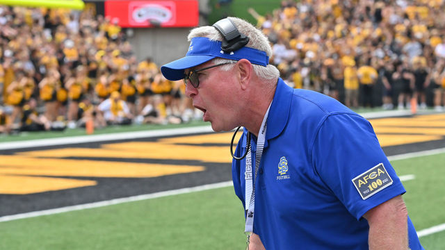 IOWA CITY, IA - SEPTEMBER 03: South Dakota State head football coach John Stiegelmeier protests the spot of the ball to an official during a college football game between the South Dakota State Jackrabbits and the Iowa Hawkeyes, September 03, 2022, at Kinnick Stadium, Iowa City, IA. Photo by Keith Gillett/Icon Sportswire via Getty Images),