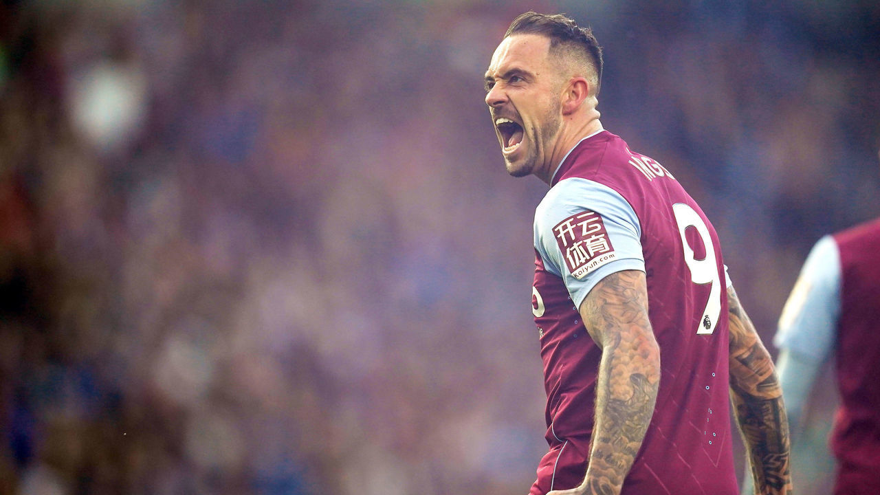 Aston Villa's John McGinn picks up a flare that was thrown onto the field after Danny Ings (not pictured) celebrates scoring their side's second goal of the game during the Premier League match at the American Express Community Stadium, Brighton. Picture date: Sunday November 13, 2022.