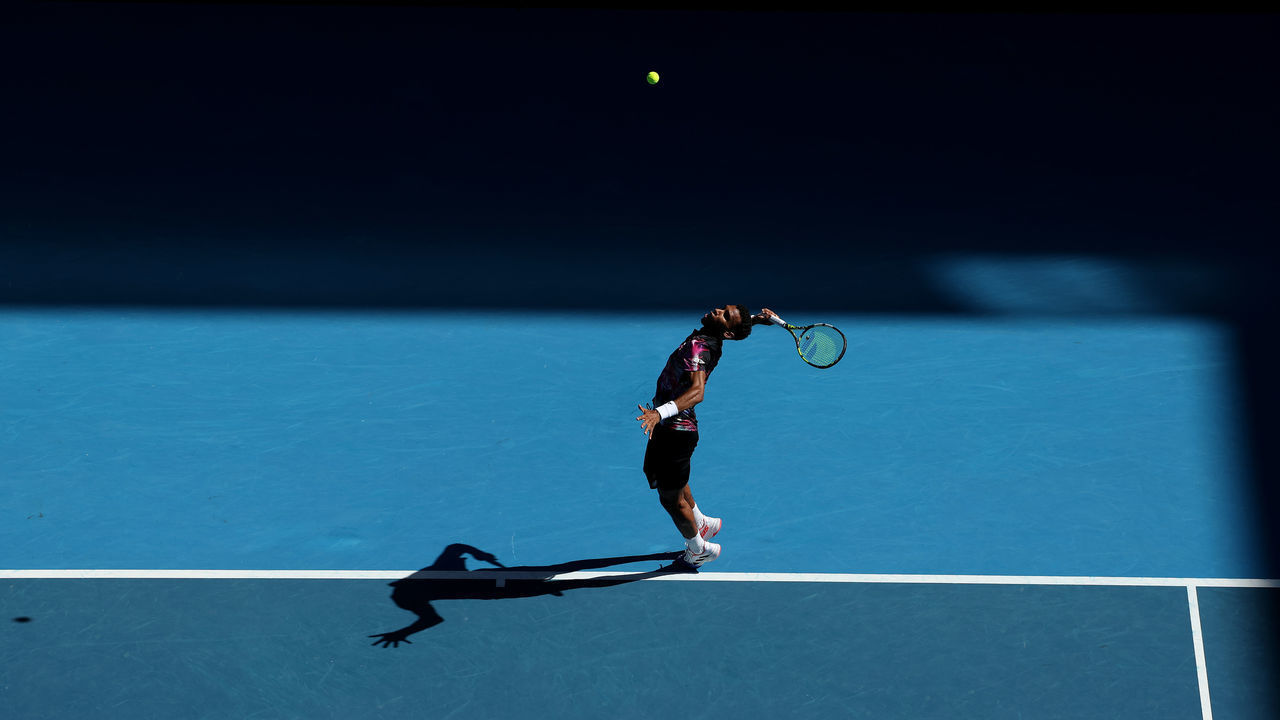 MELBOURNE, AUSTRALIA - JANUARY 20: Felix Auger-Aliassime of Canada serves during the third round singles match against Francisco Cerundolo of Argentina during day five of the 2023 Australian Open at Melbourne Park on January 20, 2023 in Melbourne, Australia.