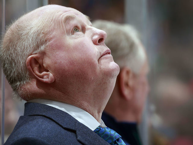 VANCOUVER, BC - APRIL 14: Head coach Bruce Boudreau of the Vancouver Canucks looks on from the bench during their NHL game against the Arizona Coyotes at Rogers Arena April 14, 2022 in Vancouver, British Columbia, Canada. "n
