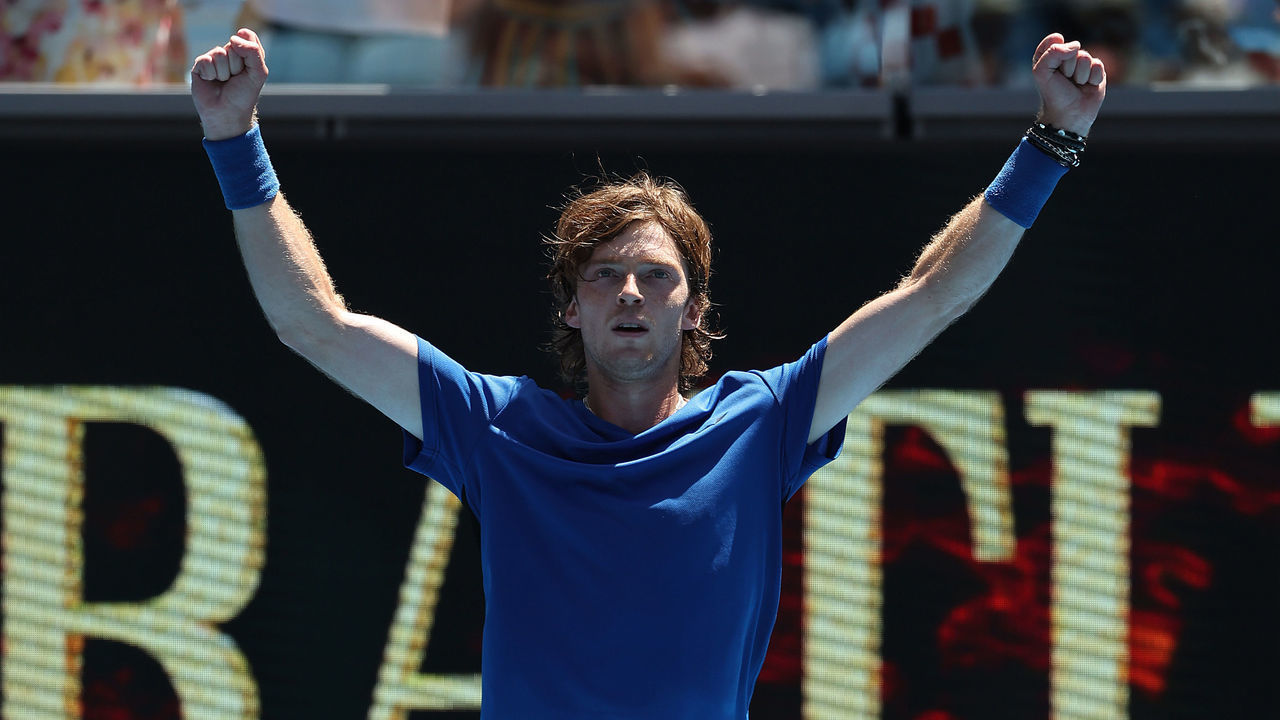 MELBOURNE, AUSTRALIA - JANUARY 21: Andrey Rublev celebrates match point during the third round singles match against Daniel Evans of Great Britain during day six of the 2023 Australian Open at Melbourne Park on January 21, 2023 in Melbourne, Australia.