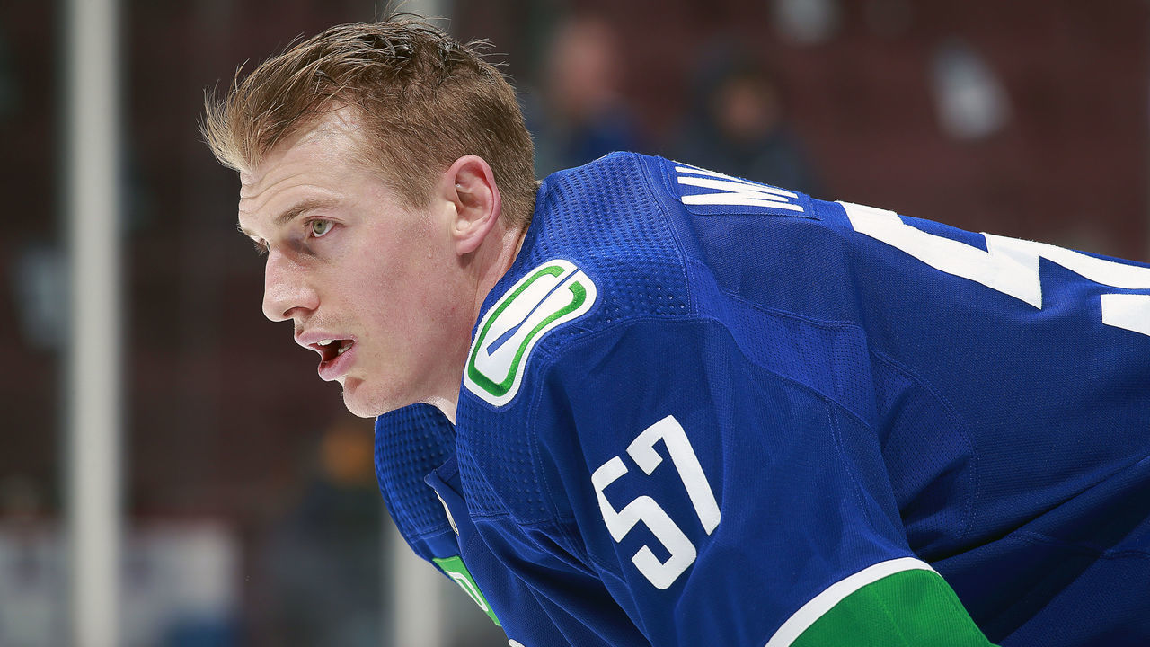 VANCOUVER, CANADA - JANUARY 3: Tyler Myers #57 of the Vancouver Canucks looks on from the bench during their NHL game against the New York Islanders at Rogers Arena January 3, 2023 in Vancouver, British Columbia, Canada.