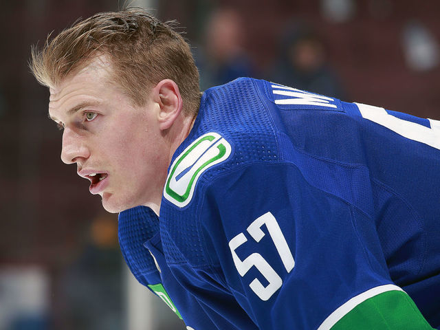 VANCOUVER, CANADA - JANUARY 3: Tyler Myers #57 of the Vancouver Canucks looks on from the bench during their NHL game against the New York Islanders at Rogers Arena January 3, 2023 in Vancouver, British Columbia, Canada.